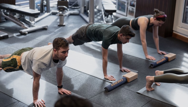 People doing push-ups in the gym