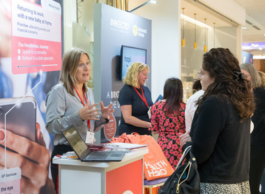 EWC21 exhibitor talking to delegate.jpg