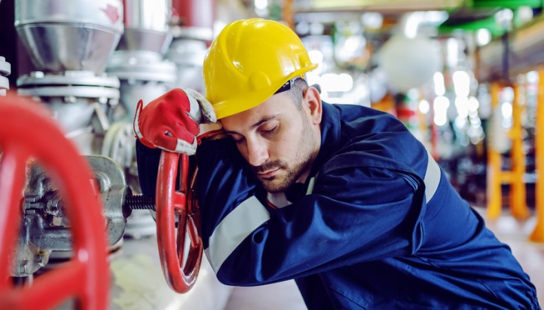 A construction worker asleep at work 